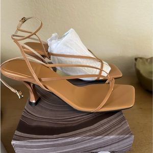 Never worn,  Jeffery Campbell, strappy sandal with a subtle heel.